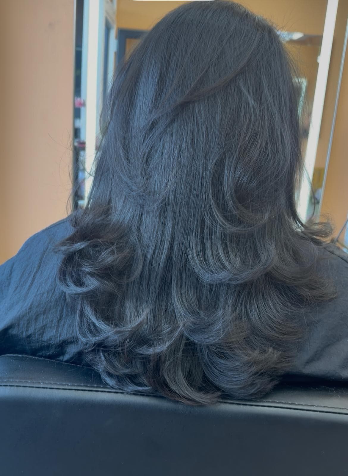 Brunette layered blowout styling near Newcastle