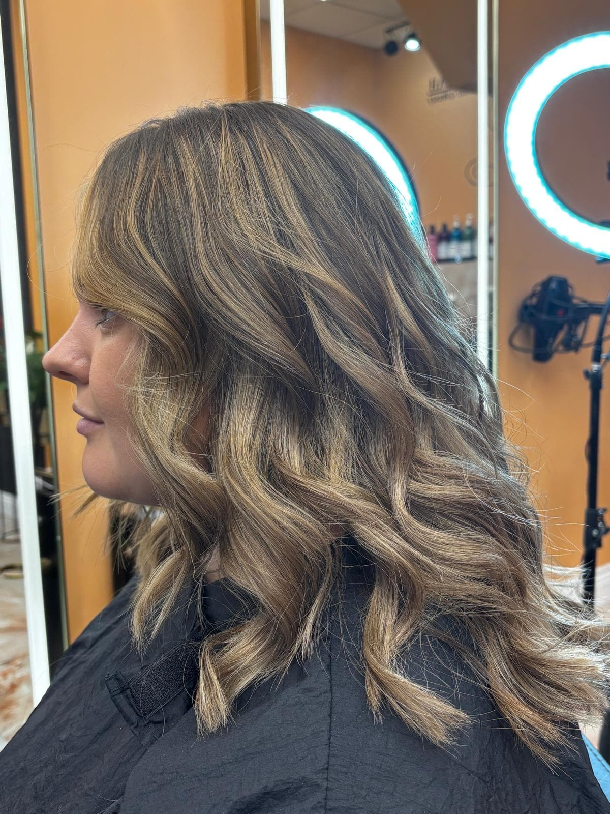 Caramel blonde balayage with beach waves in Whitley Bay